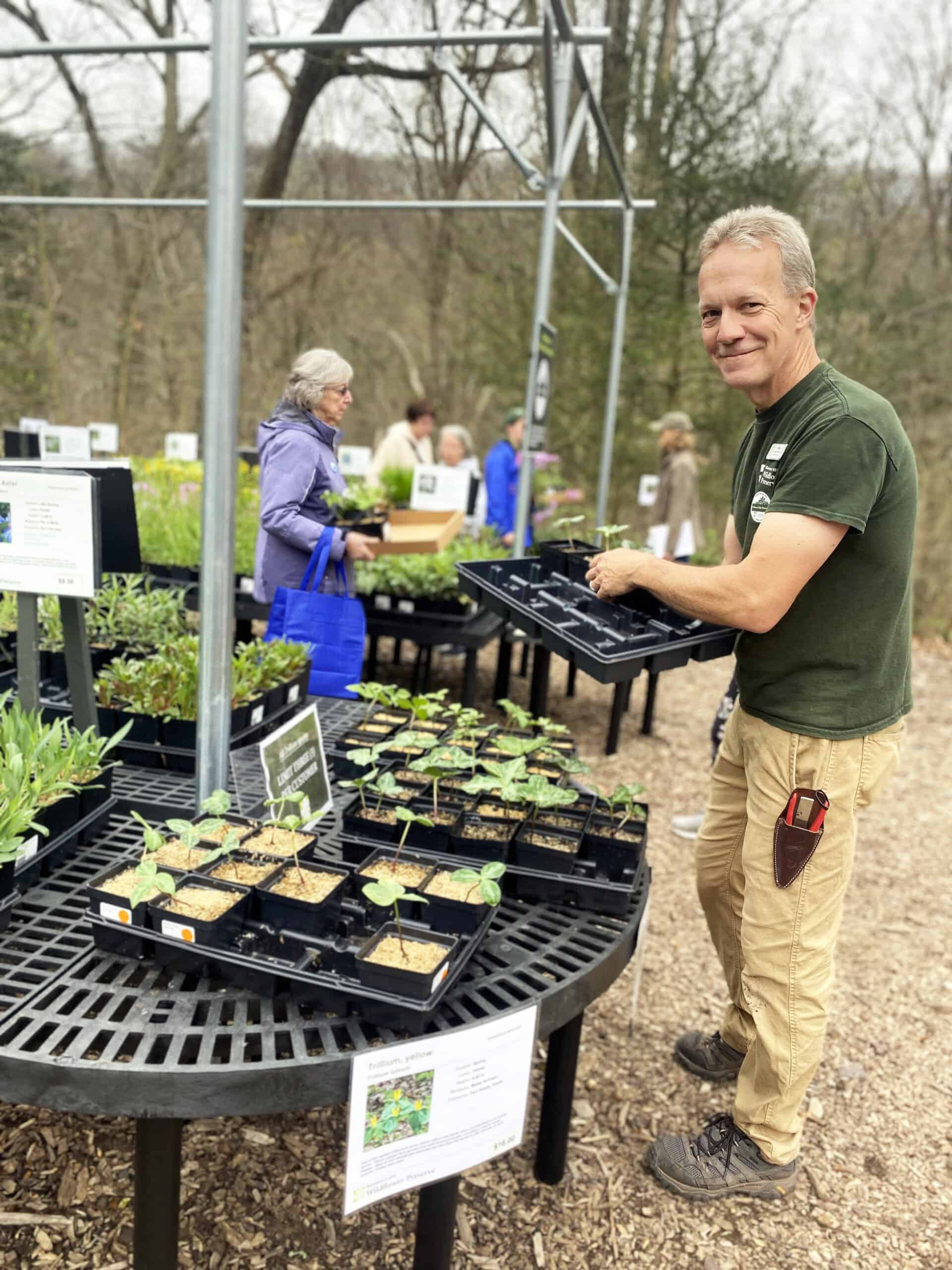 Nursery Manager Glenn White restocks the Marketplace. 